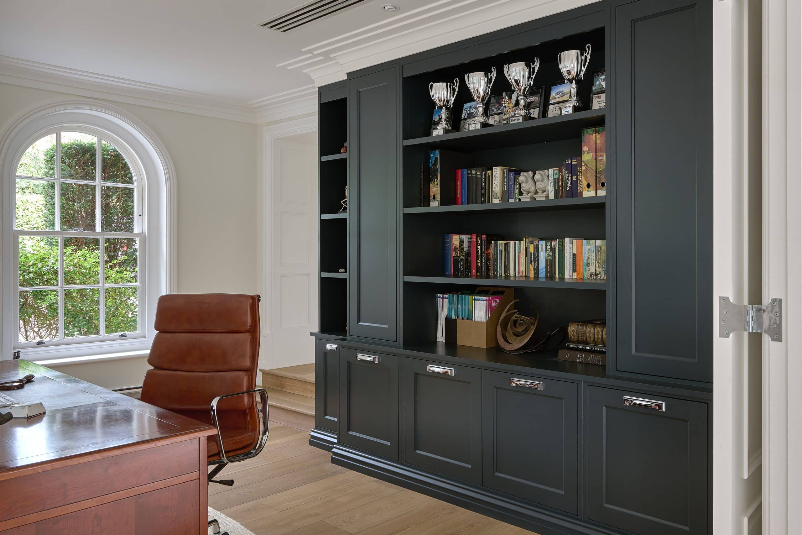 Bespoke home office with hand-painted cabinetry and pull-out printer shelf.